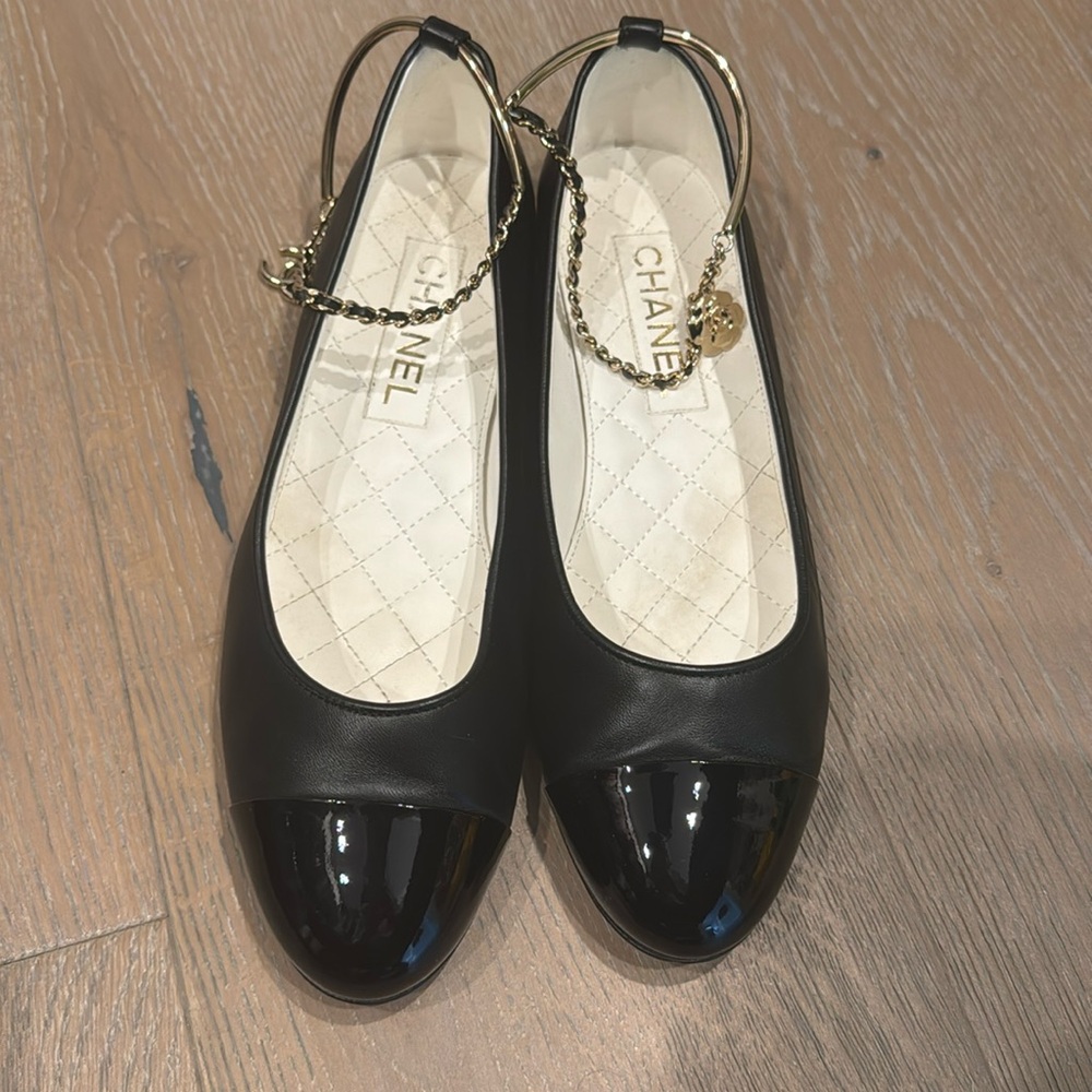 Chanel ballet flares with patent toe and chain and charms around the ankle
